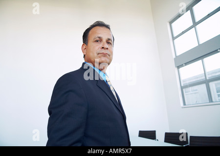 Businessman in Boardroom Banque D'Images