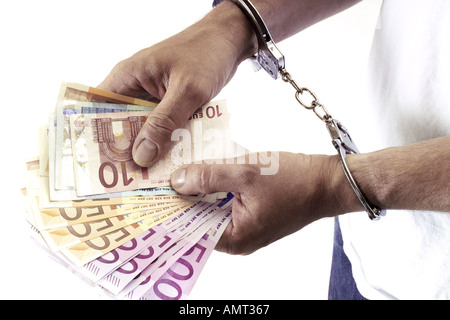Arrestation d'un homme détenant de l'argent noir Banque D'Images