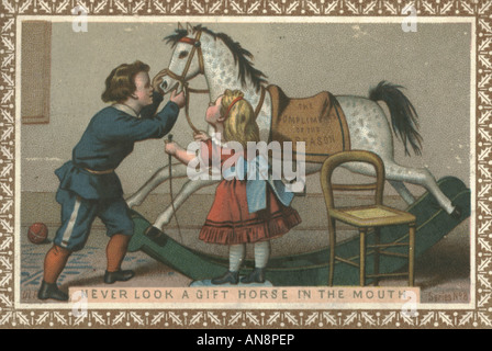 Carte de vœux de Noël intitulé Ne jamais regarder un cheval cadeau dans la bouche" vers 1875 Banque D'Images