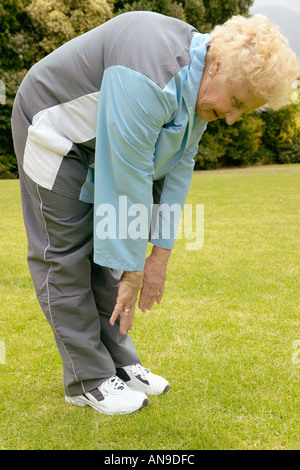 A senior woman stretching Banque D'Images