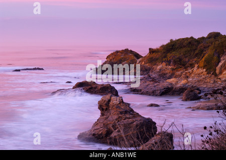 Lever du soleil sur la côte est, près de la ville de Brighton, Dunedin, île du Sud, Nouvelle-Zélande Banque D'Images