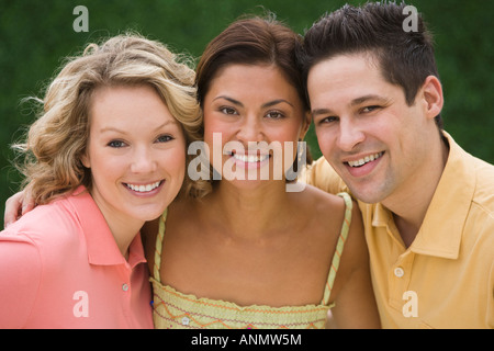 Multi-ethnic friends hugging Banque D'Images