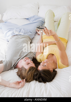 Couple taking own photograph Banque D'Images