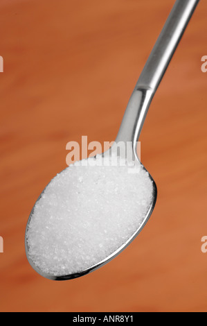 Cuillère à café de sucre blanc granulé Banque D'Images