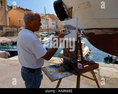 Port Vendres Pyrenees Languedoc Oriental France Artist Painting in Harbor Banque D'Images