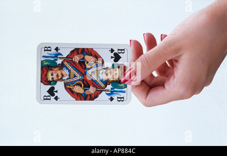 Close-up of woman's hand holding jack of spades card Banque D'Images