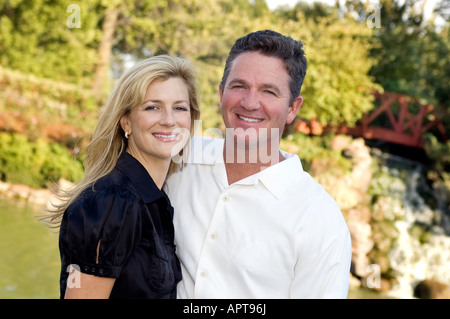 Close up portrait of middle age couple in front of parc Banque D'Images