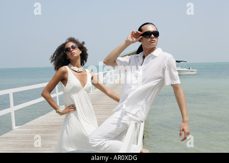 Young couple relaxing on pier. Banque D'Images