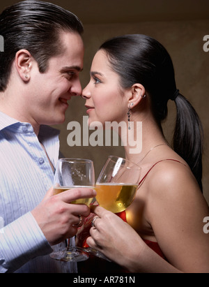 Multi-ethnic couple smiling at each other Banque D'Images