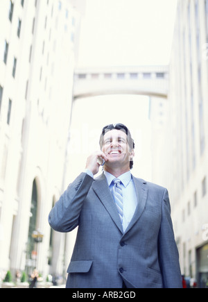 Businessman Using Cellular Phone Banque D'Images