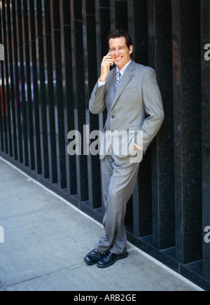 Businessman Using Cellular Phone Banque D'Images