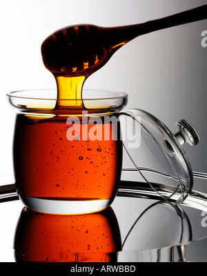 Pot de miel et balancier Banque D'Images