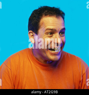 A middle aged man laughing Banque D'Images