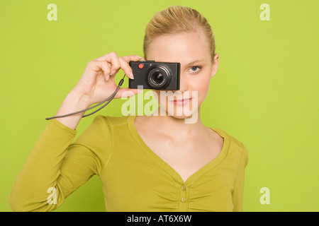 Woman with camera, portrait Banque D'Images