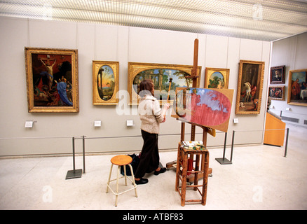 La copie d'un tableau de peintre du Louvre à Paris France Banque D'Images