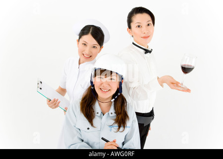 Trois jeunes femmes en uniforme professionnel Banque D'Images