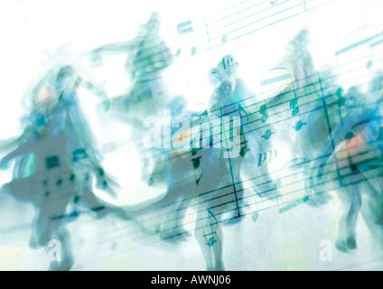 Silhouettes de danseurs superposé sur Sheet Music Banque D'Images