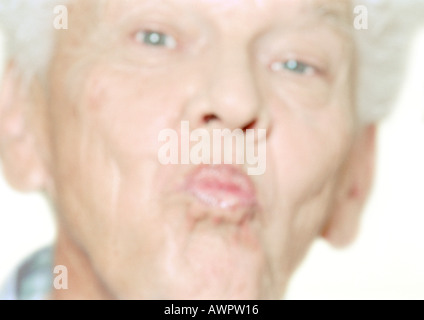 Man puckering lips, close-up, portrait Banque D'Images