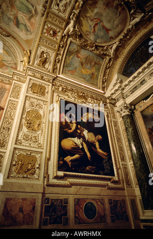 Rome. L'Italie. Crucifixion de Saint Pierre par le Caravage dans la chapelle cerasi, église de Santa Maria del Popolo. Banque D'Images