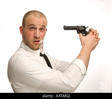 Young man holding toy gun Banque D'Images