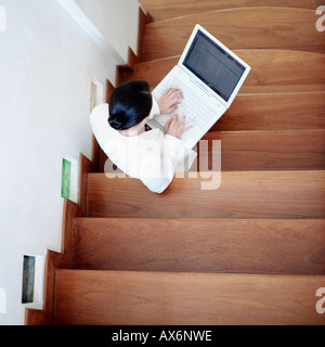 High angle view of a businesswoman using a laptop Banque D'Images