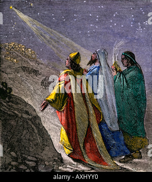 Trois rois à la suite de l'étoile pour adorer l'enfant Jésus. À la main, gravure sur bois Banque D'Images