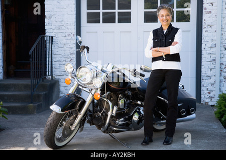 Senior African American Woman next to motorcycle Banque D'Images