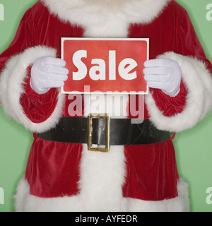 Santa Claus holding Sale sign Banque D'Images