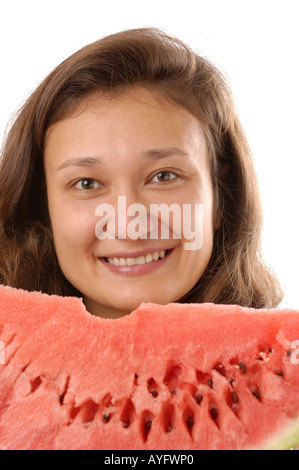 Smiling woman eating watermelon Banque D'Images