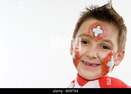 Garçon, rouged que Swiss soccer fan Banque D'Images