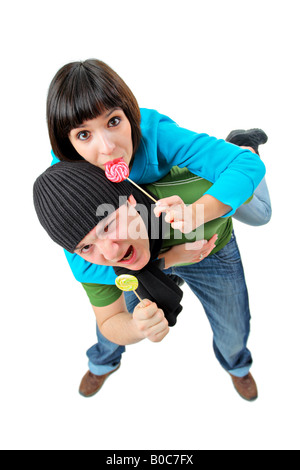 Une fille et un garçon avec lollipops Banque D'Images