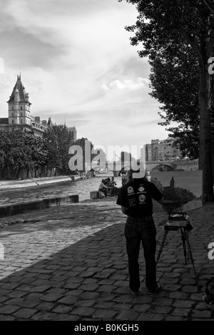 Peintre, les touristes et la Seine, Paris, France Banque D'Images