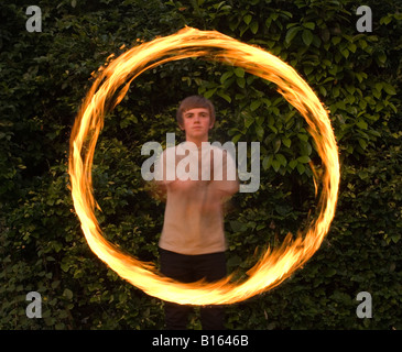 Teenage boy playing with fire personnel Banque D'Images