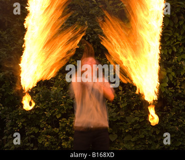 Teenage boy playing with fire personnel Banque D'Images