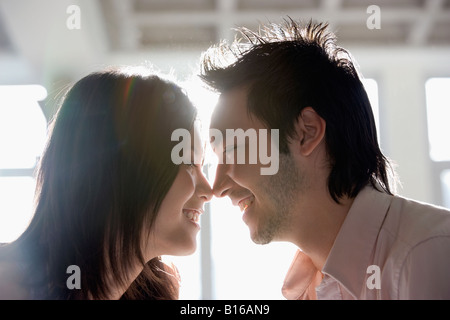 Asian couple touching noses Banque D'Images