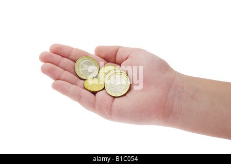 Pièces de monnaie dans la main de l'enfant sur fond blanc Banque D'Images
