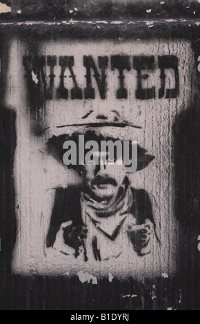 Cow-boy avis de recherche de l'écriture graffiti street art à Berlin Allemagne Banque D'Images