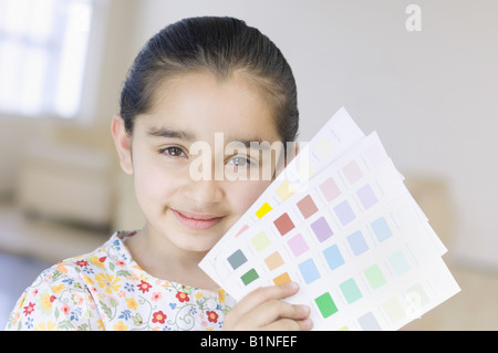 Portrait of a Girl holding color swatches Banque D'Images