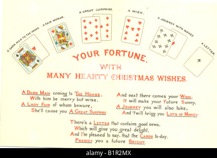 Carte de vœux de Noël montrant dire de fortune avec des cartes à jouer. Circa 1895 Banque D'Images