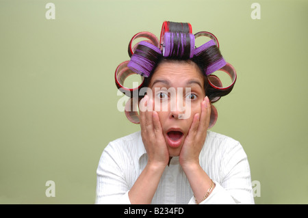 Woman wearing hair rollers Banque D'Images