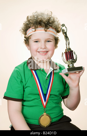 Portrait of a Boy holding a trophy Banque D'Images