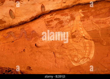 Vieux rock art des aborigènes, les kangourous de chasse avec une lance, au sud d'Alice Springs, Territoire du Nord, Australie Banque D'Images