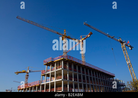Low angle view of cranes at construction site Banque D'Images