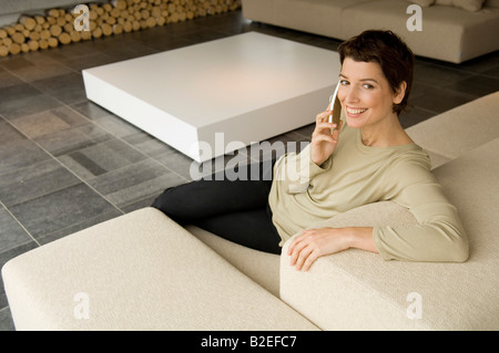 High angle view of a Mid adult Woman talking on a mobile phone Banque D'Images