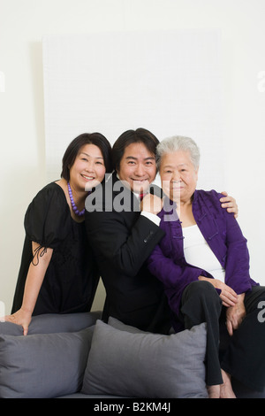 Portrait of a senior woman with her children and smiling Banque D'Images