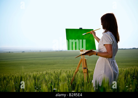 Peinture femme en champ de blé, arrière Banque D'Images