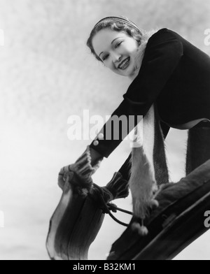 Portrait de femme à l'avant du toboggan Banque D'Images