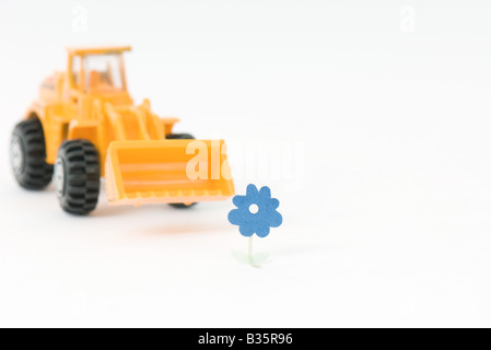 Fleur approche bulldozer jouet Banque D'Images