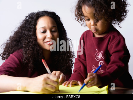 Mixed Race boy coloring Banque D'Images