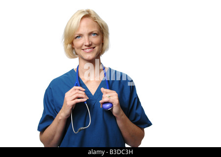 Friendly female doctor against white background Banque D'Images